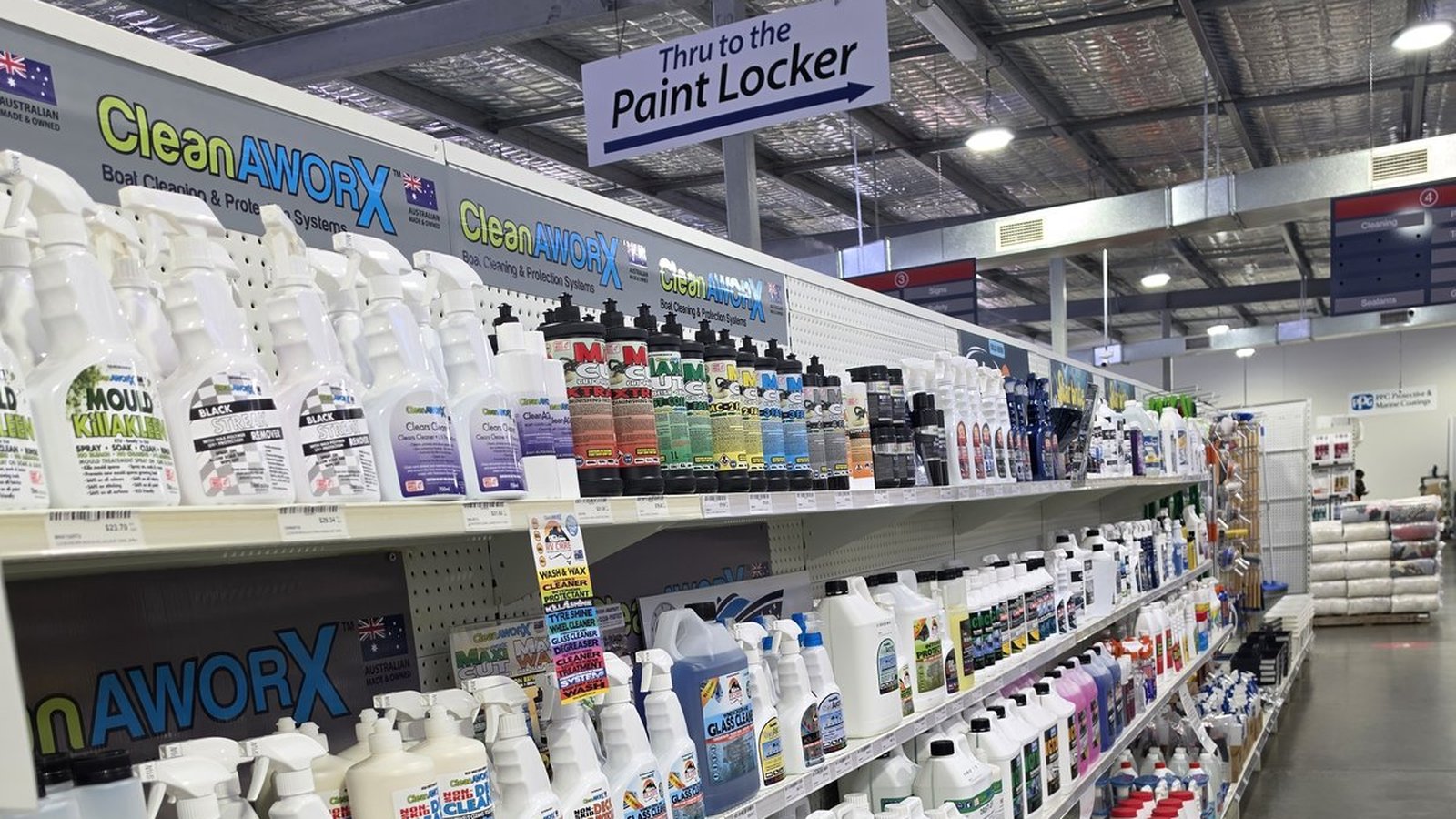 Long aisle of CleanAWORX boat cleaning products at Marine Trade Supplies & Chandlery, The Boat Works Coomera