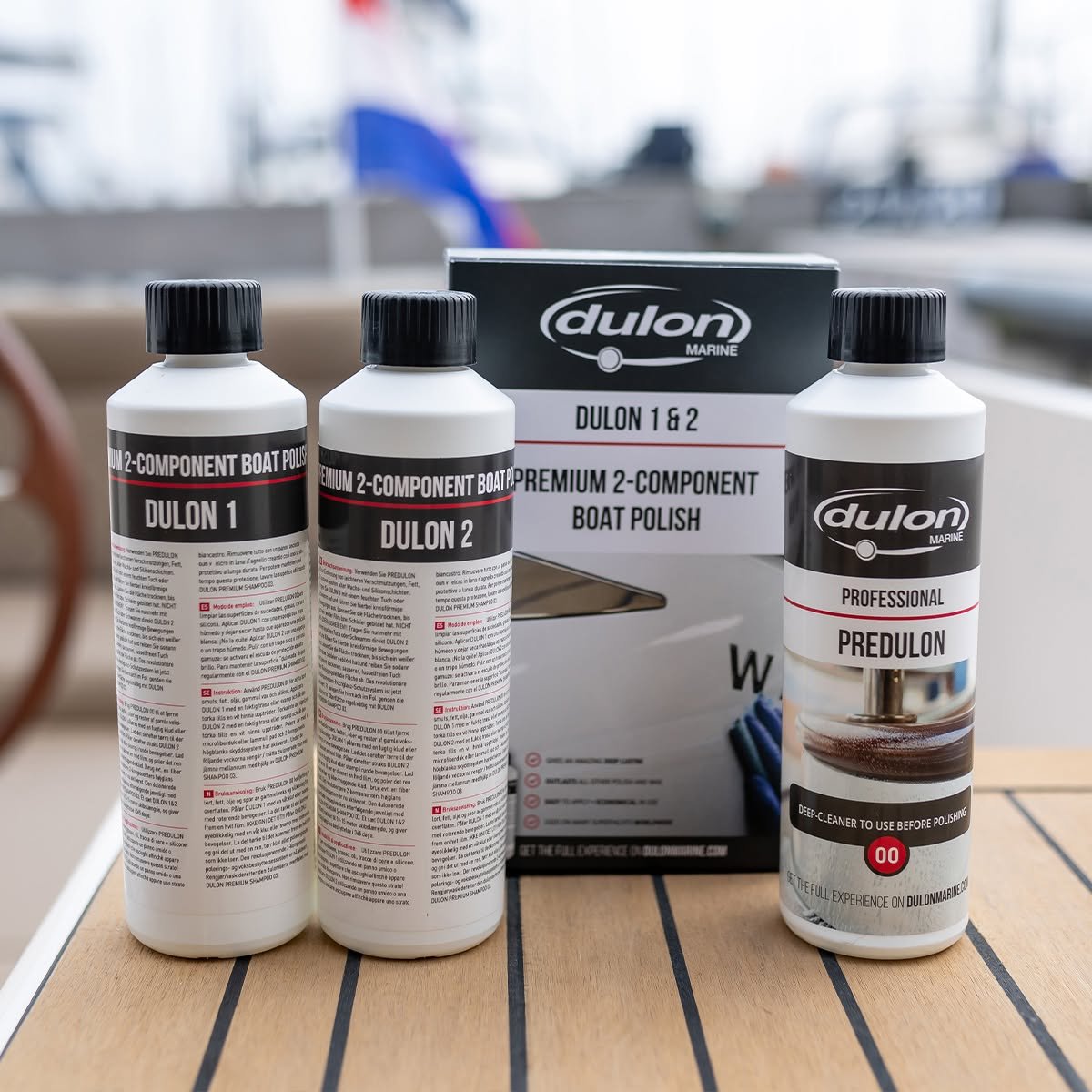 Dulon 1 and 2 Premium 2-Component Boat Polish with box and Predulon 00 deep cleaner on a teak deck at Marine Trade Supplies Coomera
